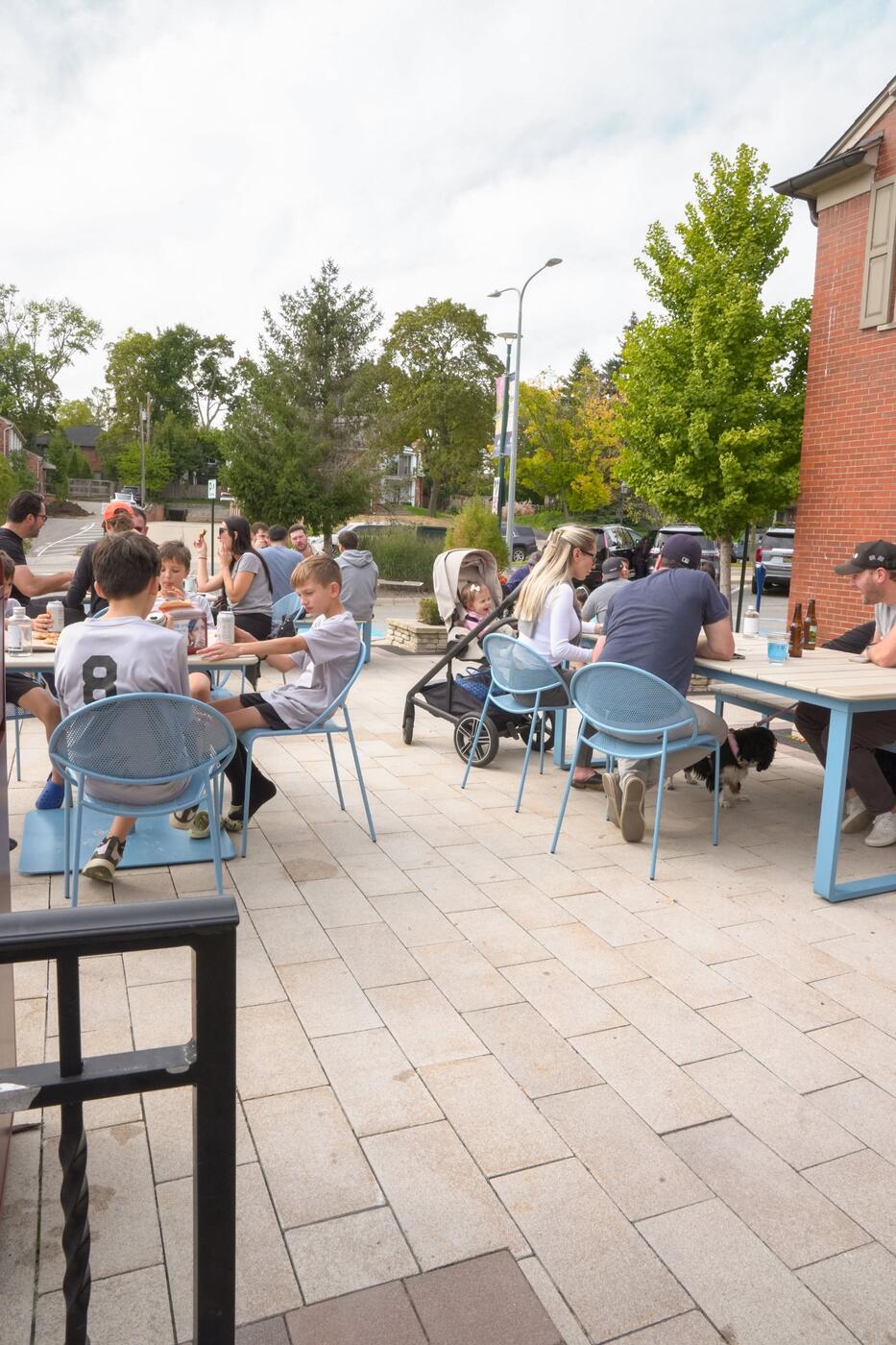 The patio full of sky blue chairs on Old Woodward